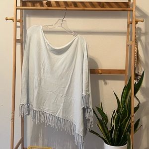 Light blue poncho with fringe